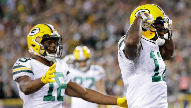 Green Bay Packers wide receiver Davante Adams (17) reacts after scoring a touchdown on a five-yard reception during the first quarter of their game against the Chicago Bears Thursday, September 28, 2017 at Lambeau Field in Green Bay, Wis.