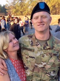 The Army is investigating the death of Adam Lorenzen. Lorenzen, pictured with his mother, Helen Lorenzen, died this week at Fort Bragg.