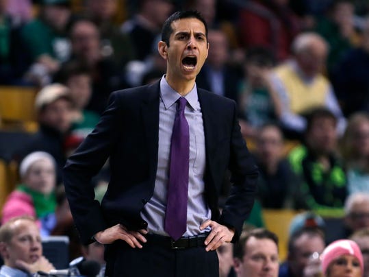 Orlando Magic head coach James Borrego calls to his players during the first quarter of an NBA basketball game against the Boston Celtics in Boston, Friday, March 13, 2015. (AP Photo/Charles Krupa)