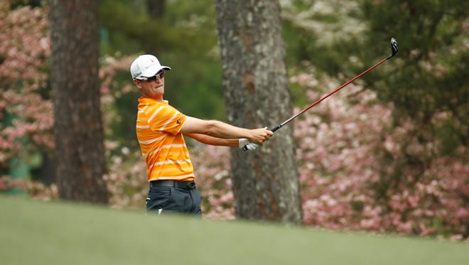 Zach Johnson plays his second shot on the 2nd hole during the first round of The Masters golf tournament at Augusta National Golf Club.