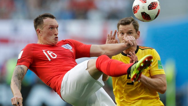 England's Phil Jones left controls a ball in front of Belgium's Jan Vertonghen during the third place match between England and Belgium at the 2018 soccer World Cup in the St. Petersburg Stadium in St. Petersburg, Russia, Saturday, July 14, 2018. (AP Photo/Petr David Josek)