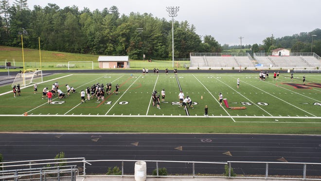 Players on the North Buncombe high school football team run through drills during practice Tuesday, August 15, 2017.