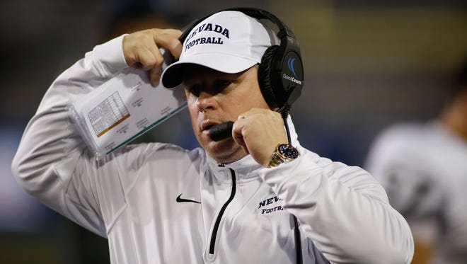 Wolf Pack coach Brian Polian leads his team against Wyoming on Saturday night.