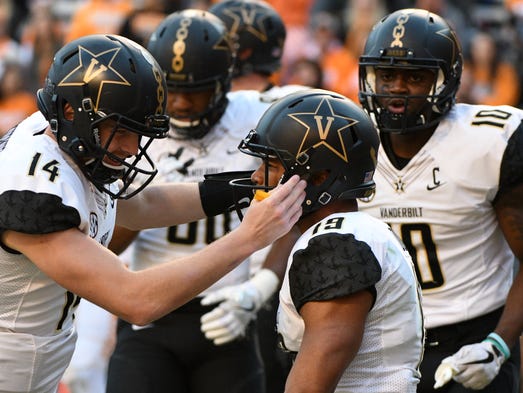 Vanderbilt quarterback Kyle Shurmur (14) celebrates