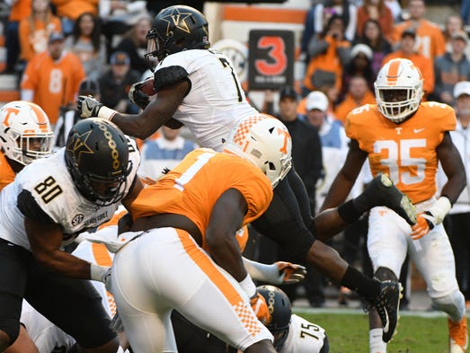 Vanderbilt running back Ralph Webb (7) jumps over the