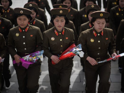 Korean People's Army soldiers arrive to pay their respects