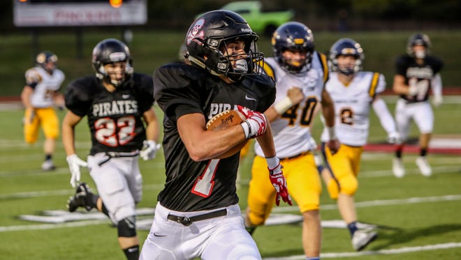Pinckney's Nick Cain returns a kickoff 97 yards for one of his four touchdowns in a 45-30 victory over South Lyon.