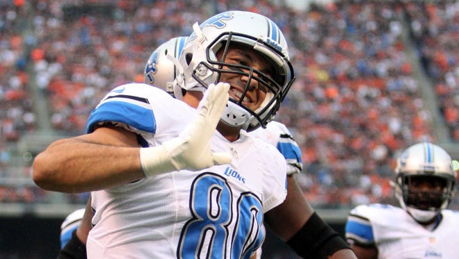 Detroit Lions' Joseph Fauria celebrates after catching a touchdown pass against the Cleveland Browns in 2013.