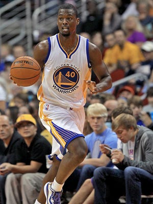 Golden State Warriors' Harrison Barnes brought the ball down court against the Denver Nuggets in an NBA preseason game at Wells Fargo Arena in Des Moines on Thursday night Oct. 16, 2014.