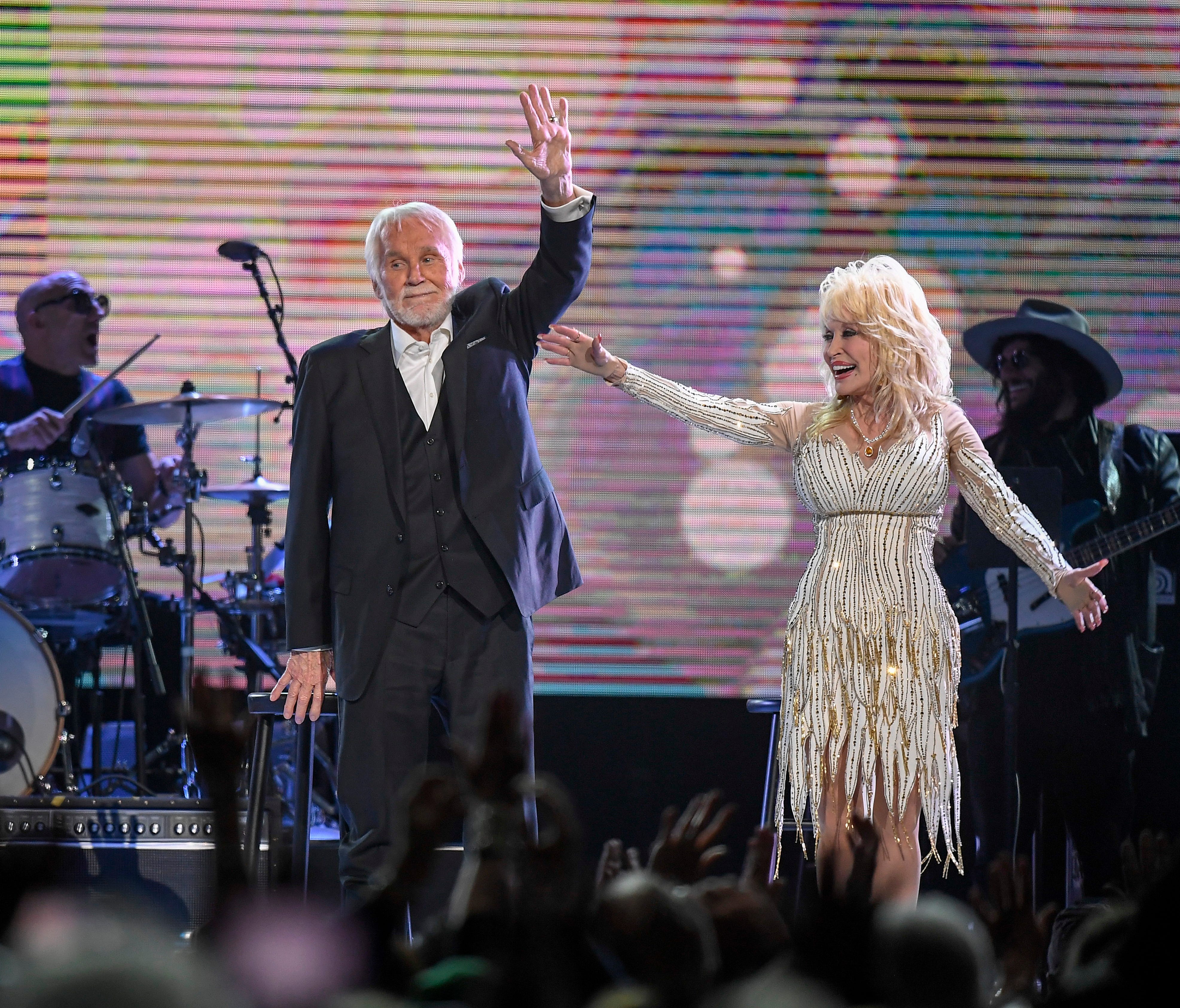 Kenny Rogers and Dolly Parton wave good-bye to the crowd after performing for the last time at the All In For the Gambler tribute to Kenny Rogers at the Bridgestone Arena in Nashville, Tenn., Wednesday, Oct. 25, 2017.