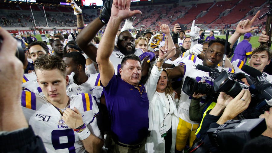 LSU head coach Ed Orgeron celebrates with his players after defeating Alabama 46-41 in an NCAA college football game, Saturday, Nov. 9, 2019, in Tuscaloosa , Ala. (AP Photo/John Bazemore)