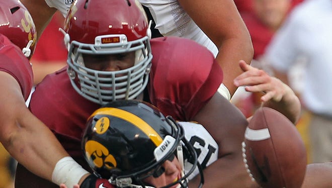 Iowa State’s David Irving tackles Iowa quarterback Jake Rudock during their 2013 game.