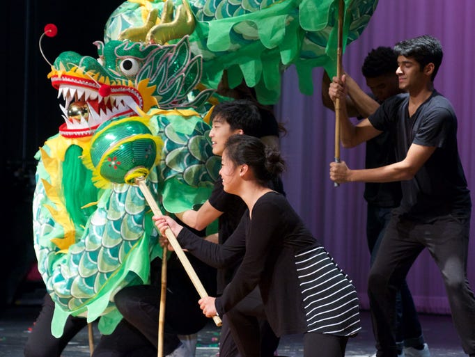 Members of the Riverside High School Atlas club hold