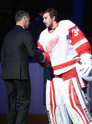 Dominik Hasek is greeted by Red Wings goaltender Petr Mrazek after a pre-game ceremony retiring Hasek's number with the Buffalo Sabres. Both are from the Czech Republic.