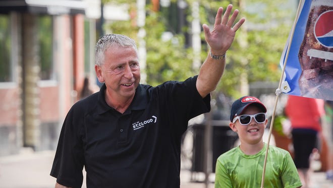 St. Cloud Mayor Dave Kleis gives a wave during the 2018 Granite City Days Parade in St. Cloud.