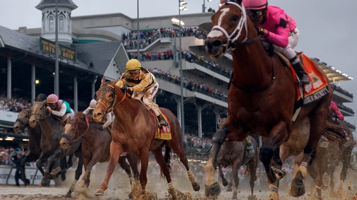 Luis Saez rides Maximum Security, right, across the finish line first against Flavien Prat on Country House during the 145th running of the Kentucky Derby horse race at Churchill Downs Saturday, May 4, 2019, in Louisville, Ky. Country House was declared the winner after Maximum Security was disqualified following a review by race stewards. (AP Photo/Matt Slocum)