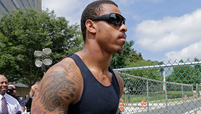 Carolina Panthers defensive end Greg Hardy leaves the Mecklenburg County jail after being released on bond in Charlotte, N.C., on May 14, 2014.