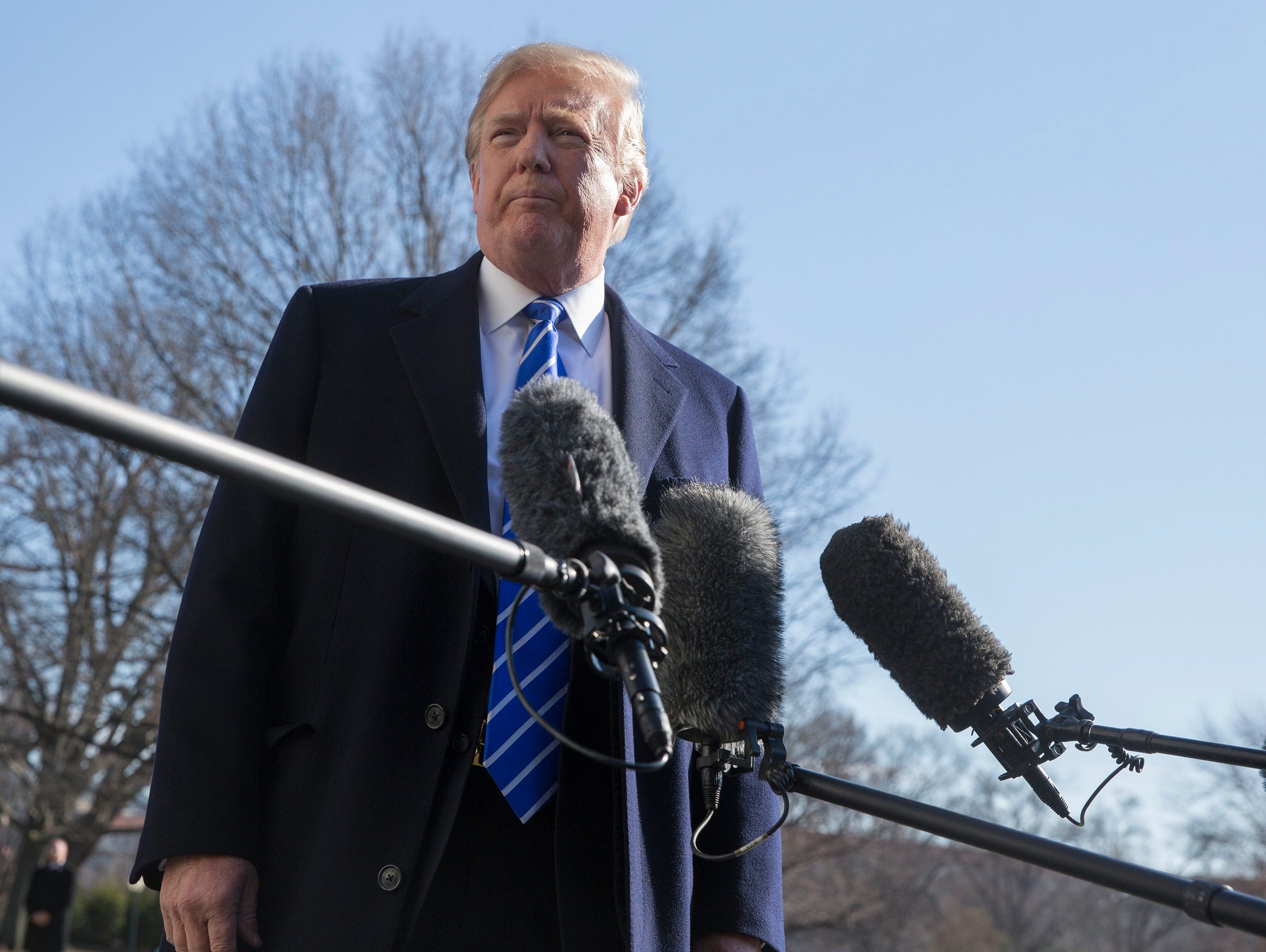 President Trump pictured speaking to the media before departing the White House for his holiday vacation last month.