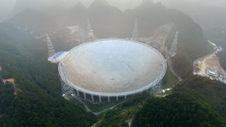 The Five-hundred-metre Aperture Spherical Radio Telescope (FAST) is seen on its first day of operation in Pingtang, in southwestern China's Guizhou province on Sept. 25, 2016.  The world's largest radio telescope began operating in southwestern China for a project that Beijing says will help humanity search for alien life.