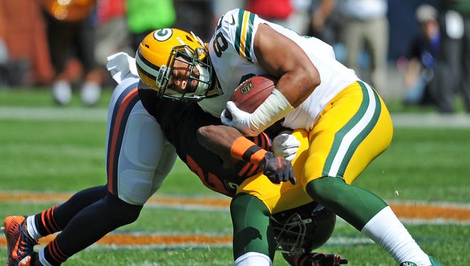 Green Bay Packers tight end Richard Rodgers  takes a hit against the Chicago Bears at Soldier Field on Sept. 13, 2015.