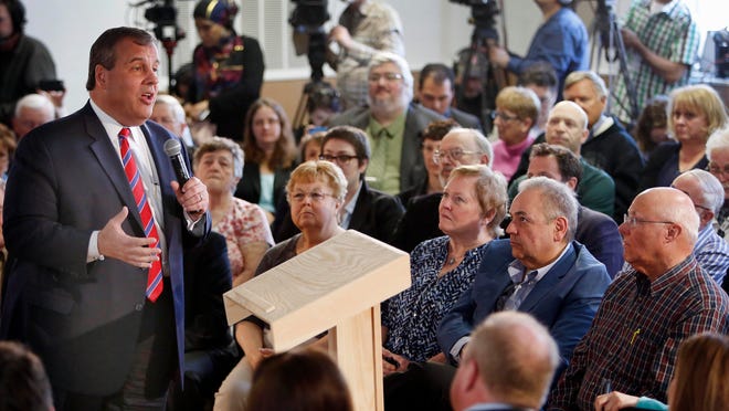 Gov. Chris Christie takes a question Wednesday during a town hall meeting with area residents in Londonderry, N.H.