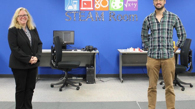 Aiken Technical College Library Director Katie Miller and STEAM Room Specialist Brian Gavin show the STEAM Room's expanded space in the Aiken Technical College Library.