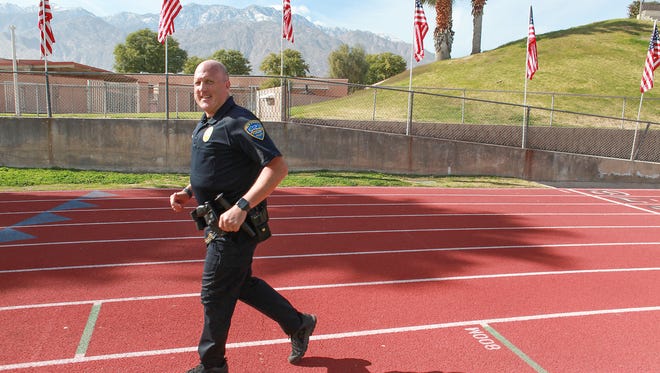 Joe Cook completes his eighteenth mile jogging out of fifty that the Palm Springs Police Officer was doing to honor fallen law enforcement officials from around the country.    