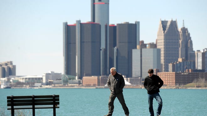 Ryan McNaboe, right, 25, of Harper Woods, walks with his father, Jerry McNaboe, left, 61, of Bakersfield, CA, at Sunset Point along The Detroit River. The elder McNaboe is visiting his son, who is a sailing coach for the Cranbrook and Grosse Pointe Yacht Clubs. XXXXPeople visit Belle Isle after Michigan Department of Natural Resources (DNR) officials present information about the island to Detroit City Council members, Tuesday afternoon, March 29, 2016. (Todd McInturf, The Detroit News)2016.