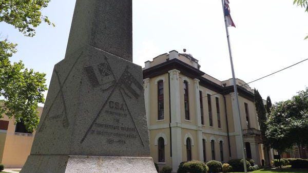 A monument honoring Confederate soldiers stands tall on the Bastrop County Courthouse lawn. It was erected by the local chapter of the United Daughters of the Confederacy in 1910.