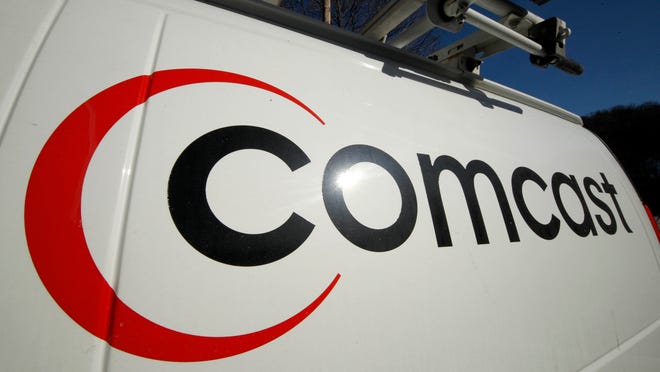 FILE - This Feb. 11, 2011 file photo shows the Comcast logo on one of the company's vehicles, in Pittsburgh. Comcast has agreed to buy Time Warner Cable for $45.2 billion in stock, or $158.82 per share, in a deal that would combine the top two cable TV companies in the nation, according to a person familiar with the matter who spoke on condition of anonymity because it had not been announced formally. An announcement is set for Thursday morning, Feb. 13, 2014, the person said. (AP Photo/Gene J. Puskar, File)