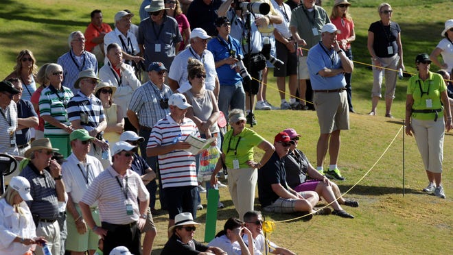 Spectators follow Patrick Reed on the ninth hole of the Nicklaus Private Course at PGA West during the third round of the 2014 Humana Challenge on Jan. 18.