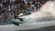 Carl Edwards wrecks into the catch fence coming to