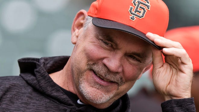 FILE - In this April 7, 2018, file photo, San Francisco Giants manager Bruce Bochy watches batting practice before a baseball game against the Los Angeles Dodgers in San Francisco. Bochy has made only six posts since opening his Twitter account in November, 2017.  He may spend more time on social media after enjoying the reaction from Braves right-hander Brandon McCarthy and McCarthy’s wife, Amanda, to his latest post. (AP Photo/John Hefti, File)