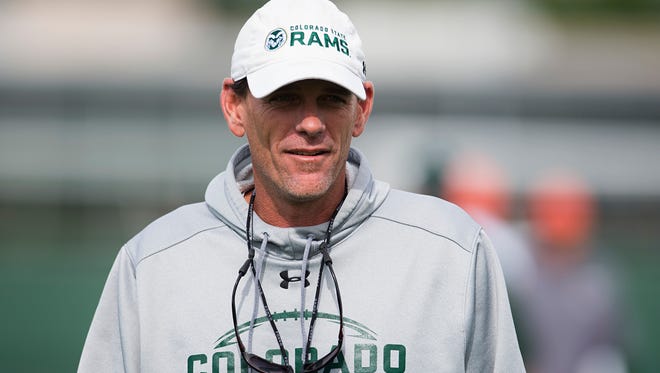 CSU coach Mike Bobo watches over the Rams' practice Tuesday. CSU opens the season Friday in Denver against the University of Colorado.