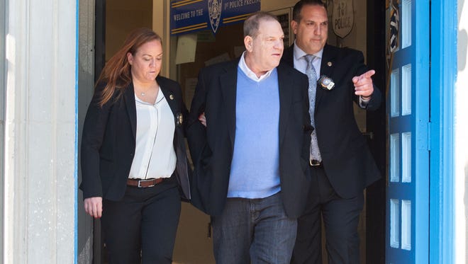 Harvey Weinstein leaves the New York City Police Department's First Precinct in handcuffs on his way to a Manhattan courthouse for his arraignment on May 25, 2018.