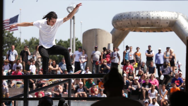 Pro skateboarder Leo Romero grinds up the rail onto the stage during the Red Bull Hart Lines street skateboarding competition on Friday May 8, 2015, at Hart Plaza in downtown Detroit.