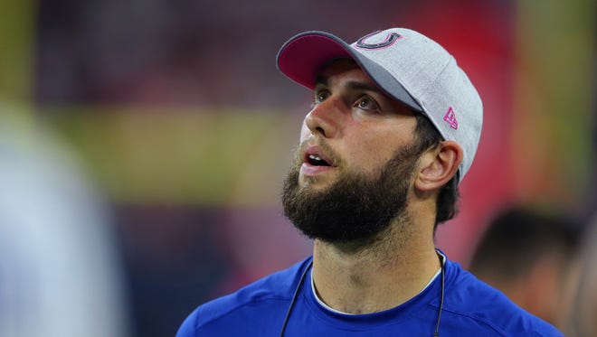 Indianapolis Colts quarterback Andrew Luck (12) looks up to the video board to watch a replay during the second half of an NFL football game Thursday, Oct. 8, 2015, at NRG Stadium in Houston, Texas.