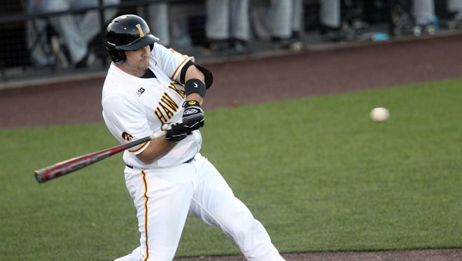 Iowa's Jake Adams takes a swing during the Hawkeyes' game against Loras College at Duane Banks Field on Wednesday, Feb. 22, 2017.