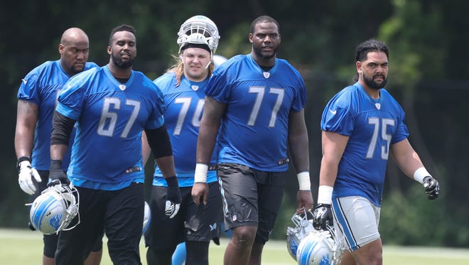 Detroit Lions linemen leave the field after minicamp Wednesday, June 14, 2017 at the practice facility in Allen Park.