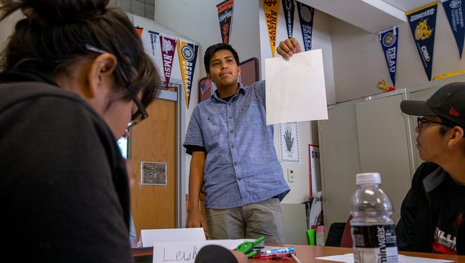 Student Sincere Antonio presents his findings after an exercise Thursday during a mathematics camp at Navajo Preparatory School in Farmington.