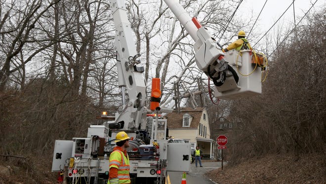 An Orange & Rockland crew repairs power lines  in Valley Cottage, New York, on March 5, 2018. Power had been out in the neighborhood since March 2.