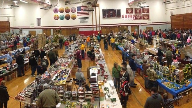 A panoramic photo of the interior of the New Holstein school gym, with vendors set up for the annual toy show.