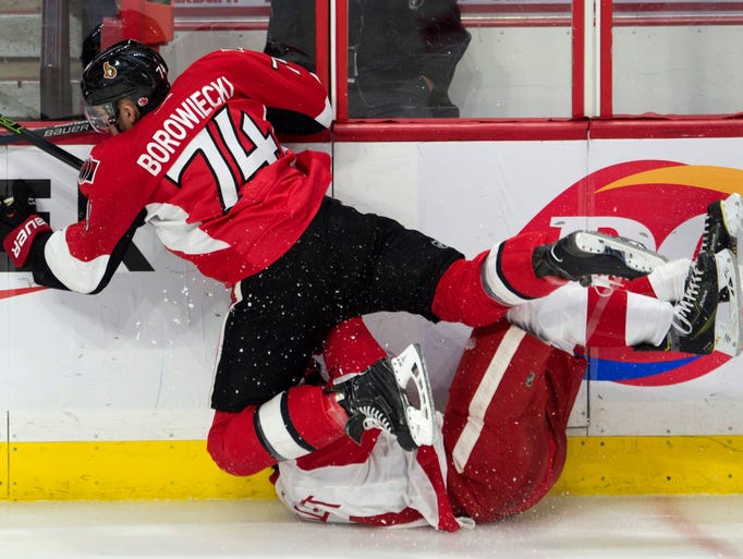 Ottawa Senators' defenseman Mark Borowiecki collides
