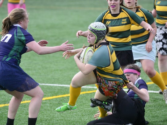 UVM women's rugby plays match in prom dresses