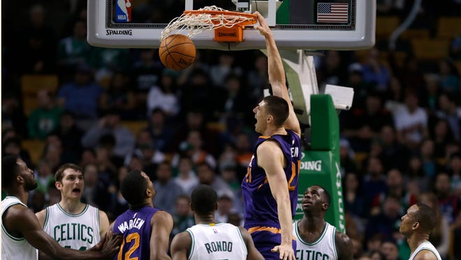 Phoenix Suns center Alex Len dunks against the Celtics in Boston on Monday, Nov. 17, 2014.