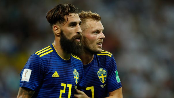 Sweden's midfielder Jimmy Durmaz (left), shown...