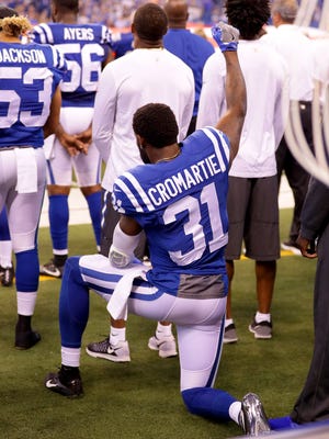 Indianapolis Colts cornerback Antonio Cromartie (31) shows his support of a cause by kneeling during the playing of the National Anthem during pre-game of an NFL football game Sunday, Sept. 25, 2016, at Lucas Oil Stadium.