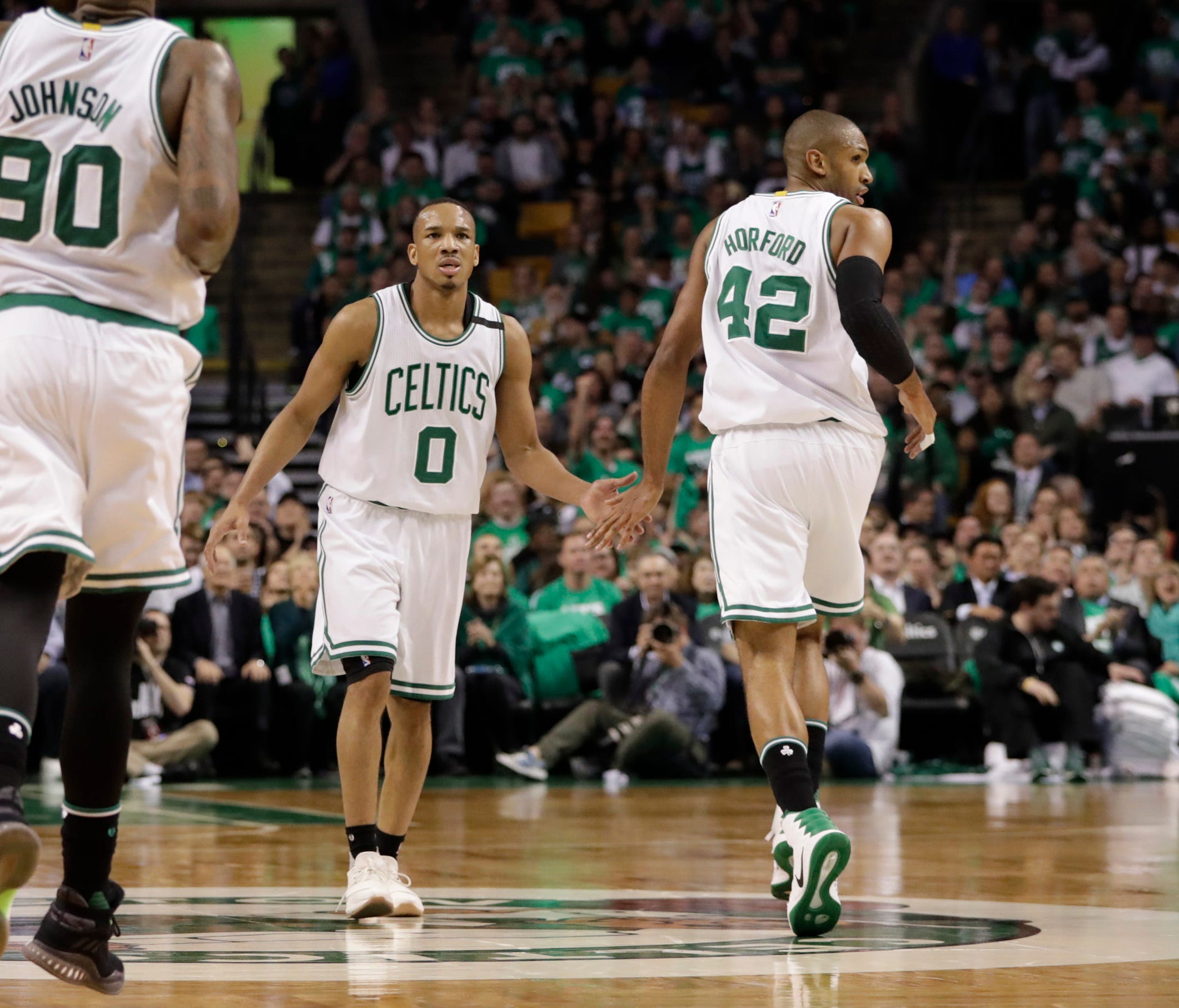 Boston Celtics guard Avery Bradley (0) and center Al Horford (42) react to a play against the Washington Wizards during the second half in Game 5.