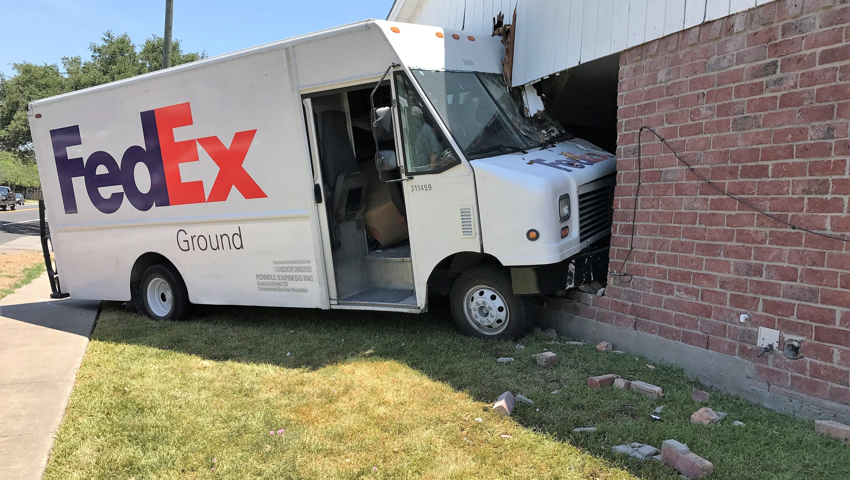 FedEx delivery truck strikes Southside home