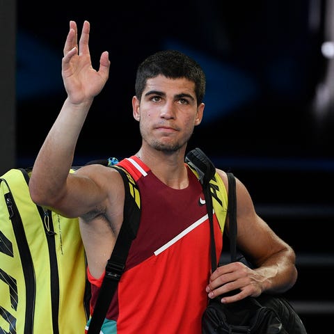 FILE- Carlos Alcaraz of Spain waves as he leaves R